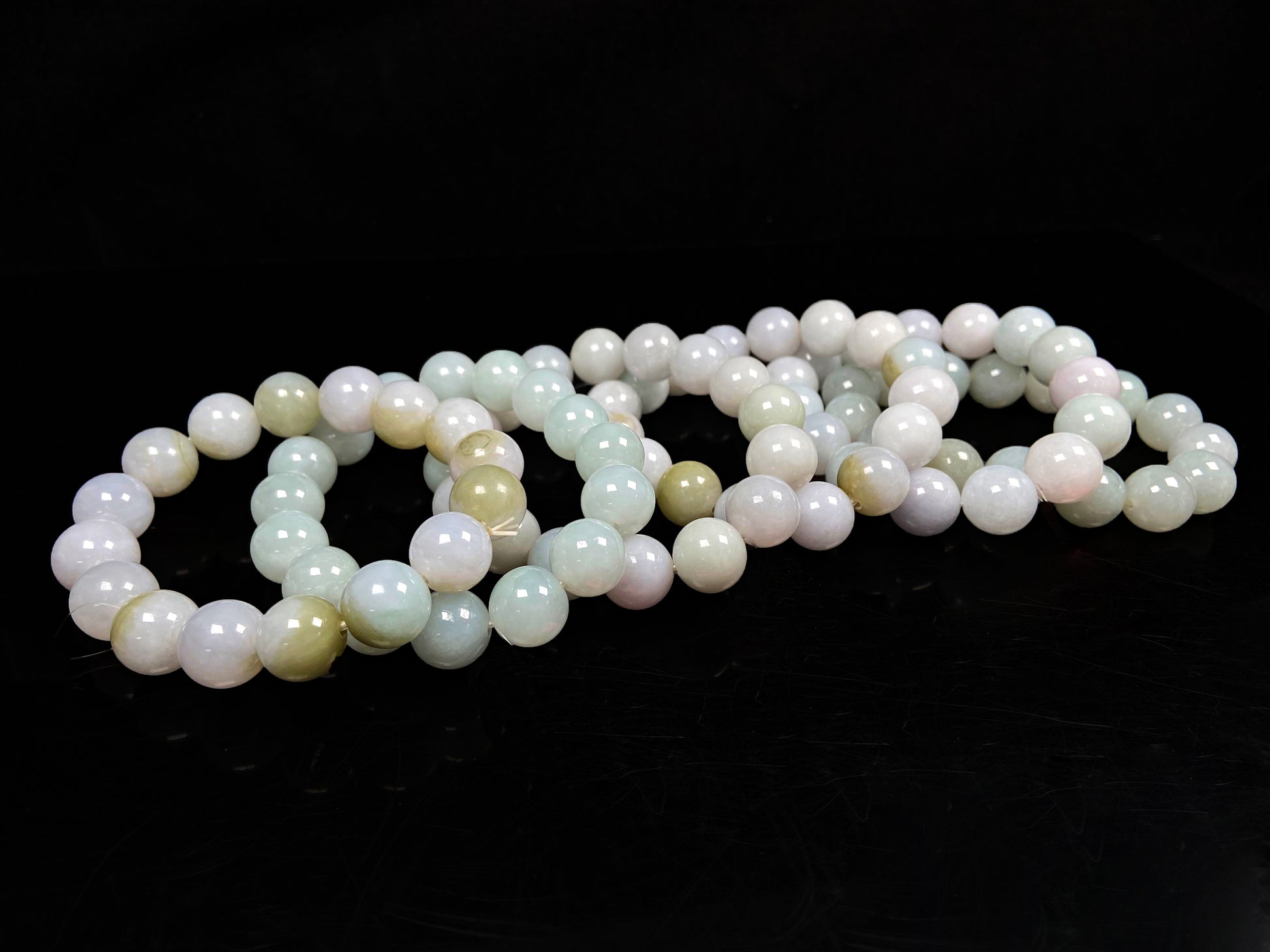 A creamy white soft green mix jadeite beads bracelet group.