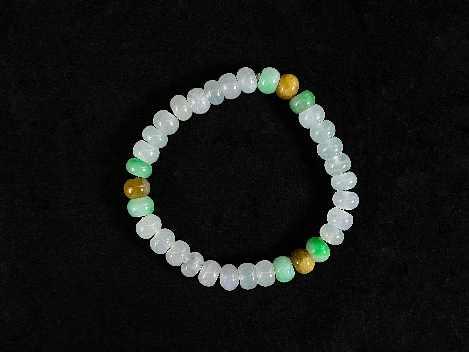 Crystalline beads with verdant and caramel hues.