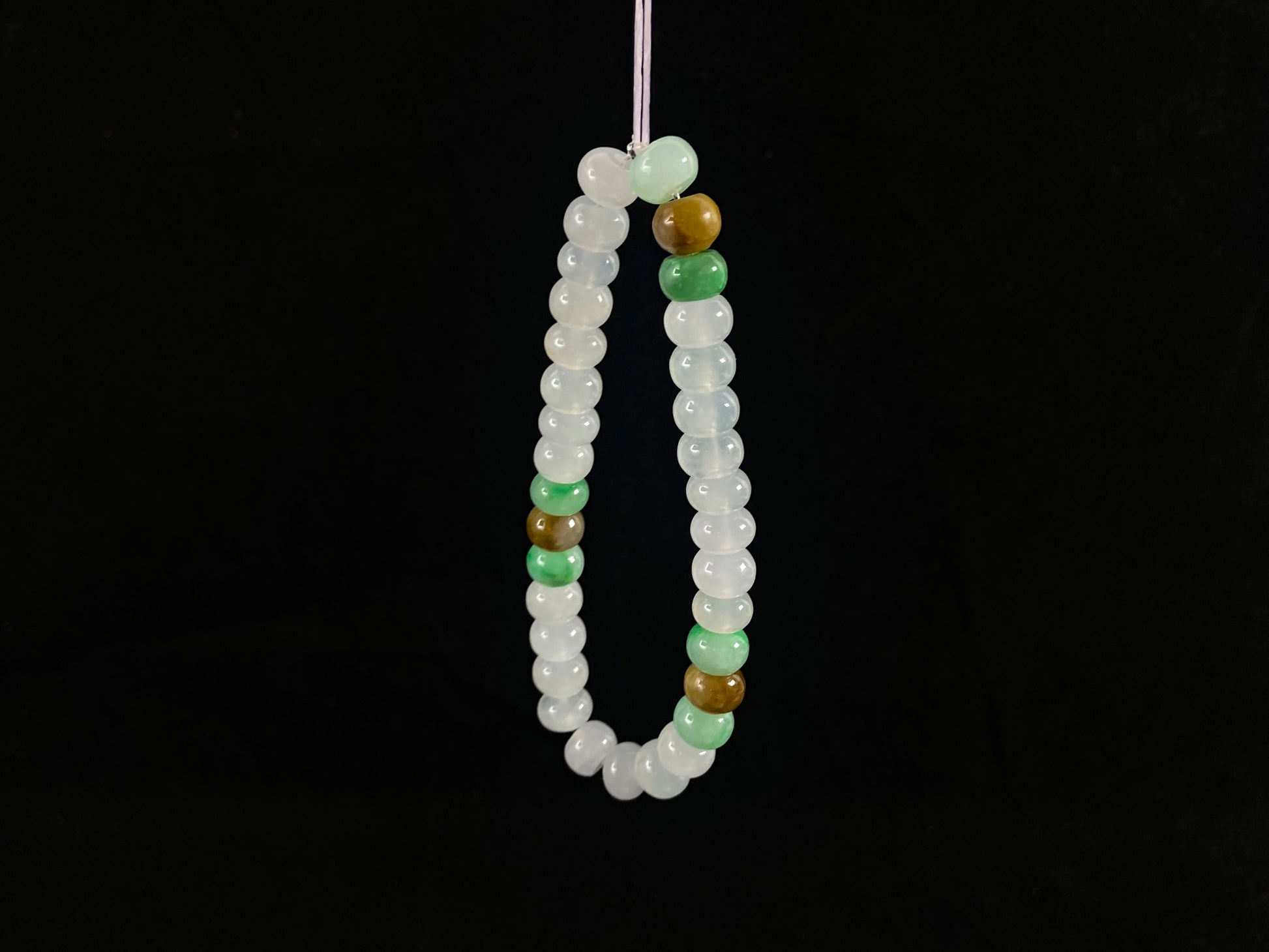 Crystalline beads with verdant and caramel hues.