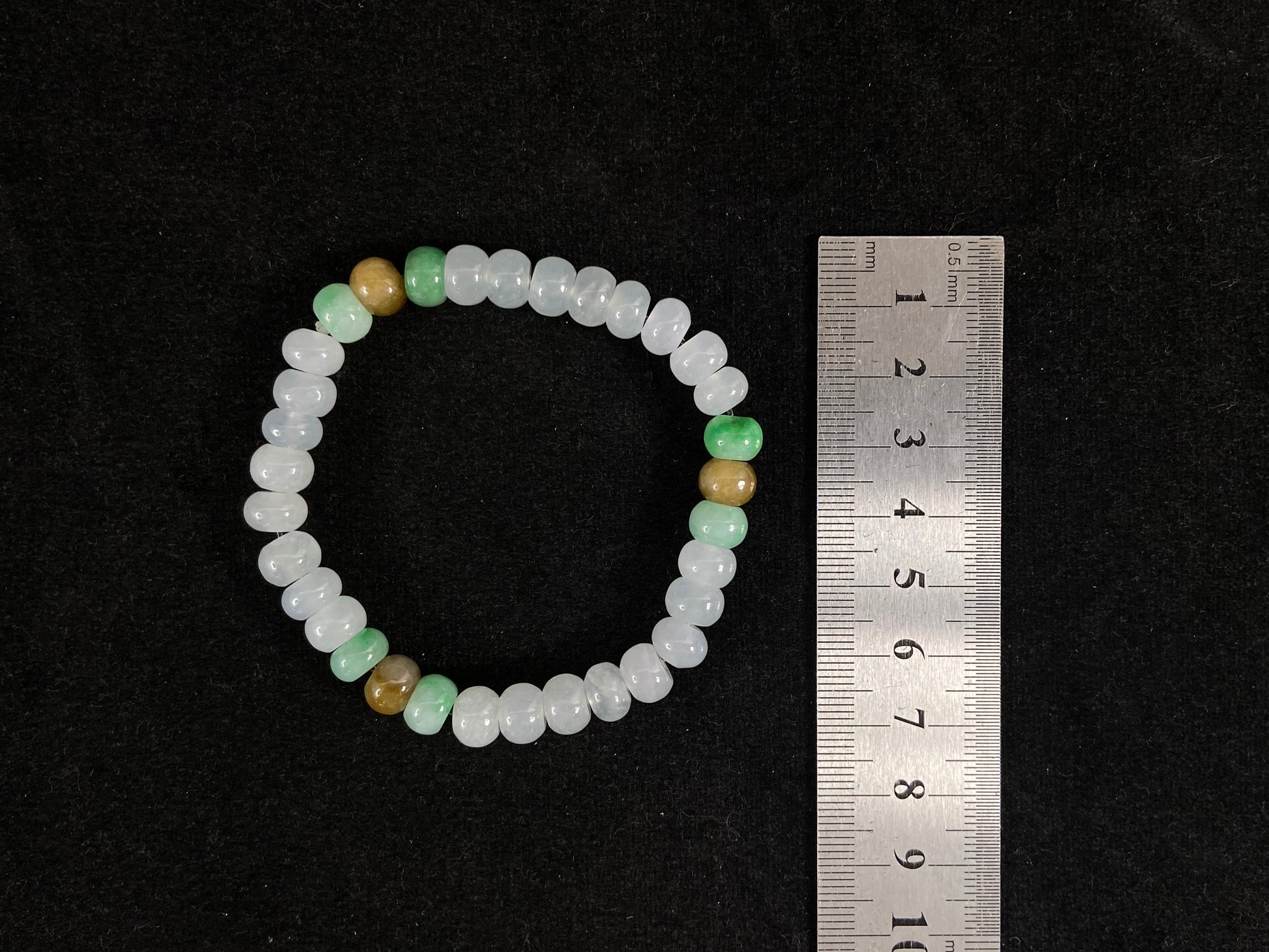 Crystalline beads with verdant and caramel hues.