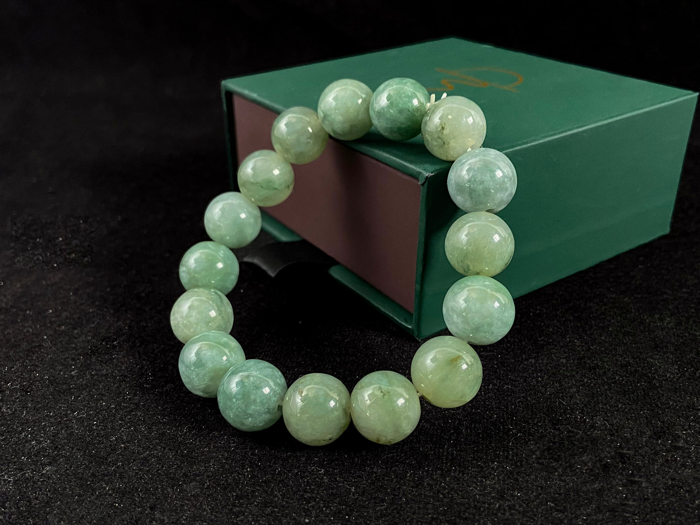 A jade bead strand with a blue base color.