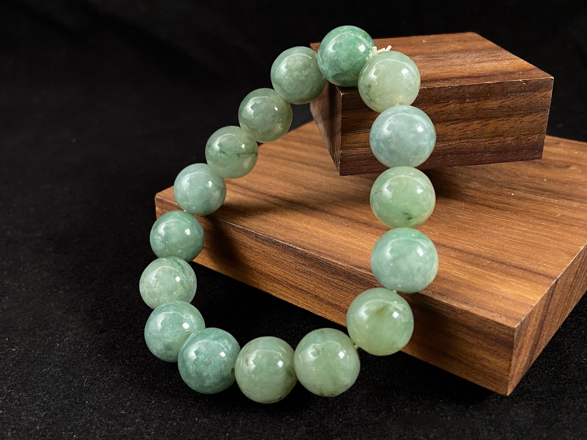 A jade bead strand with a blue base color.