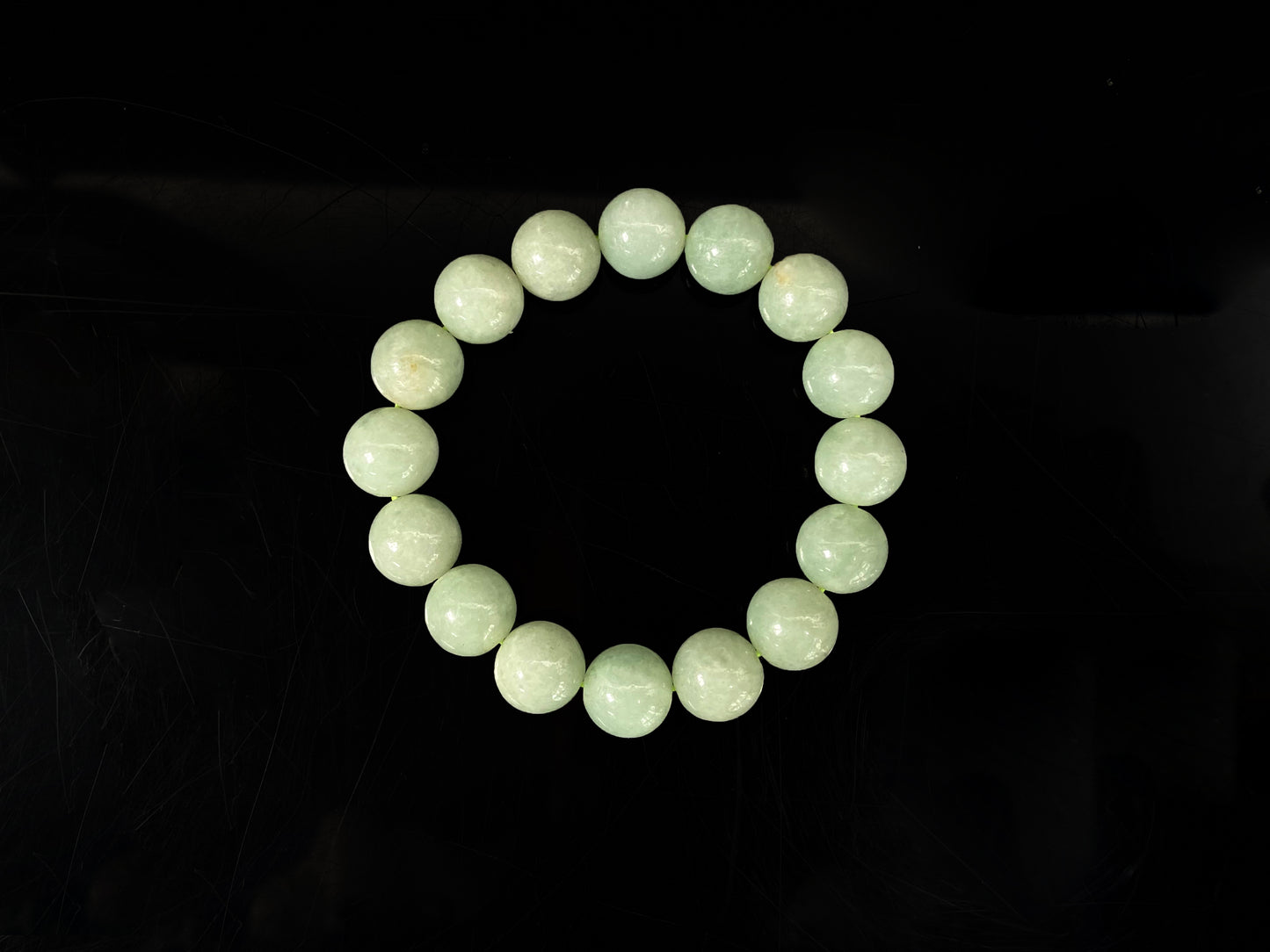 A apple green jade strand jadeite beads bracelet.