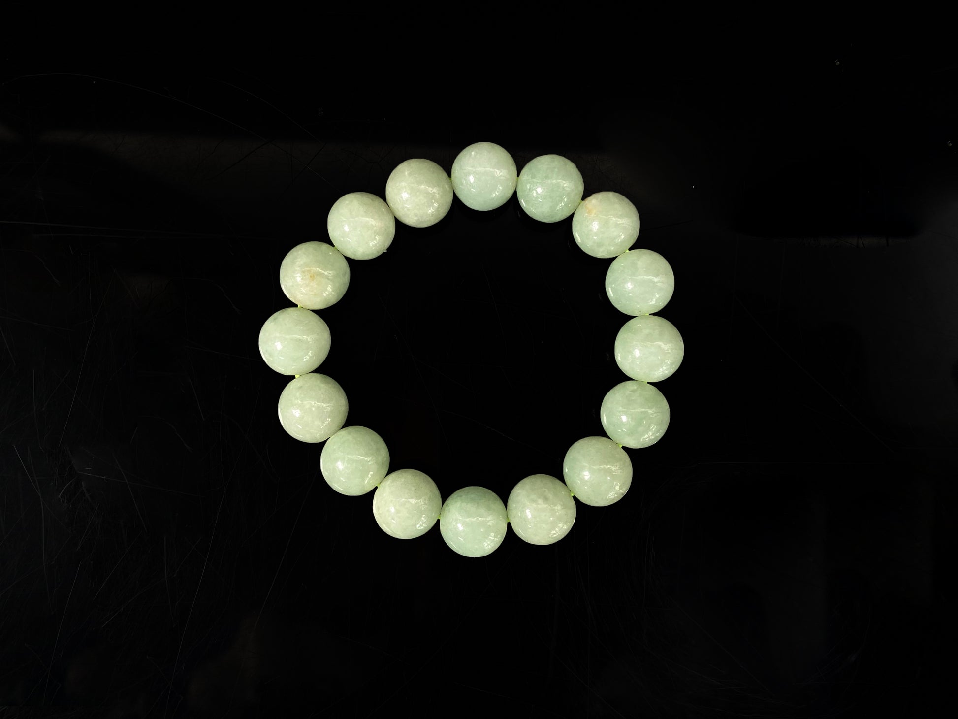 A apple green jade strand jadeite beads bracelet.