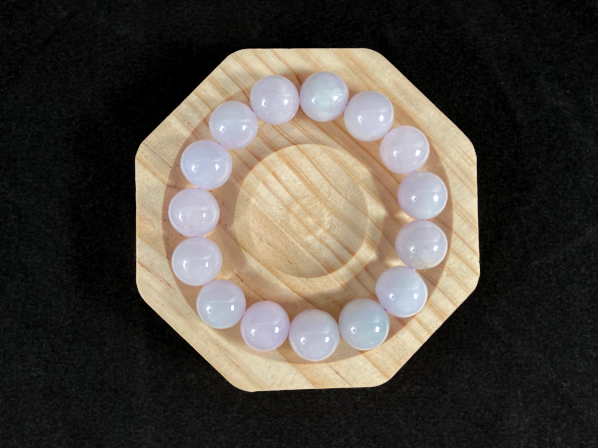 A jade bead strand composed entirely of creamy white beads.