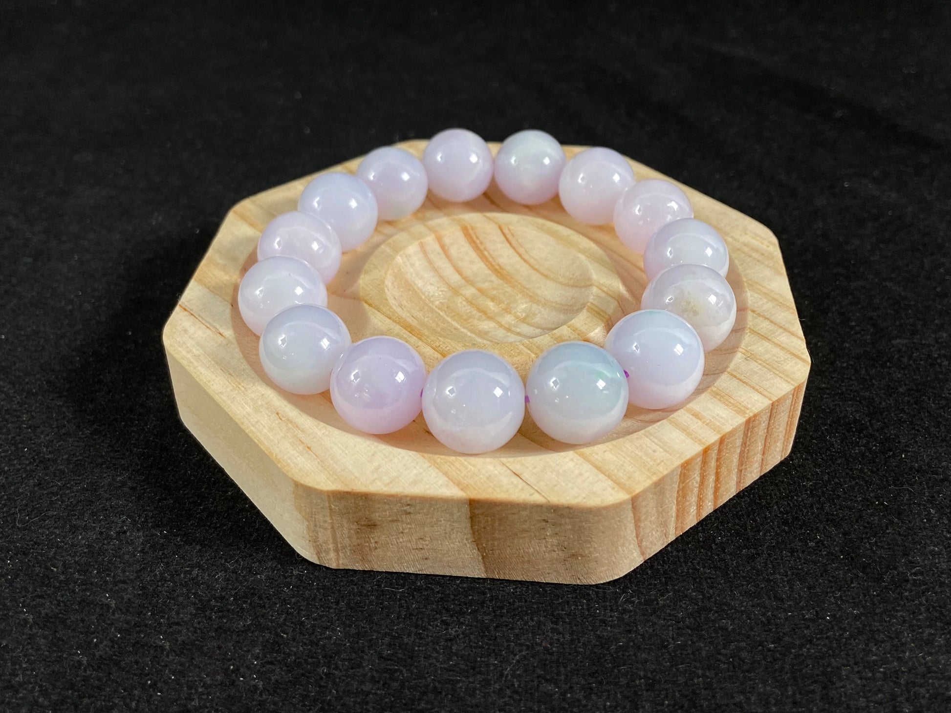 A jade bead strand composed entirely of creamy white beads.