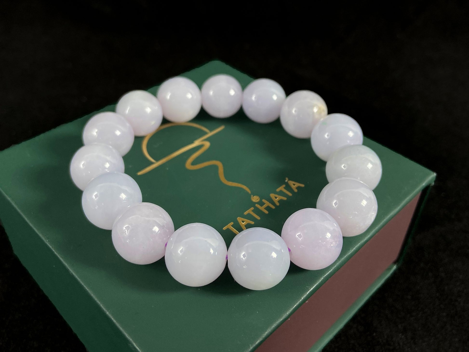 A jade bead strand composed entirely of creamy white beads.