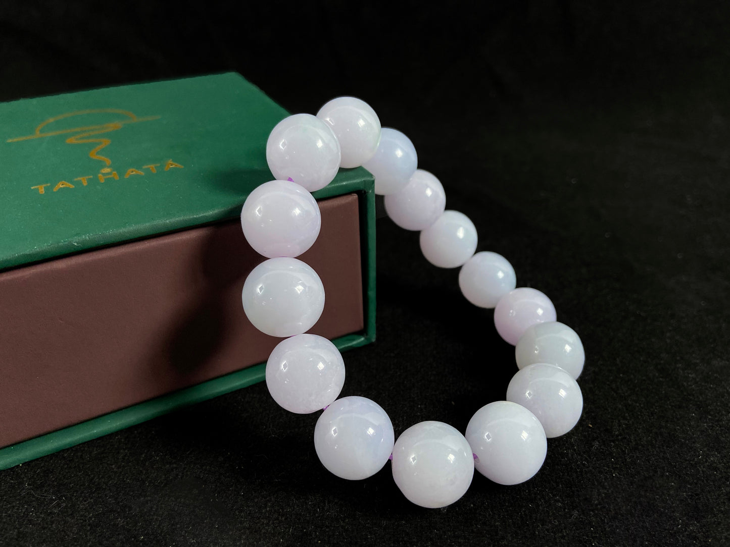 A jade bead strand composed entirely of creamy white beads.