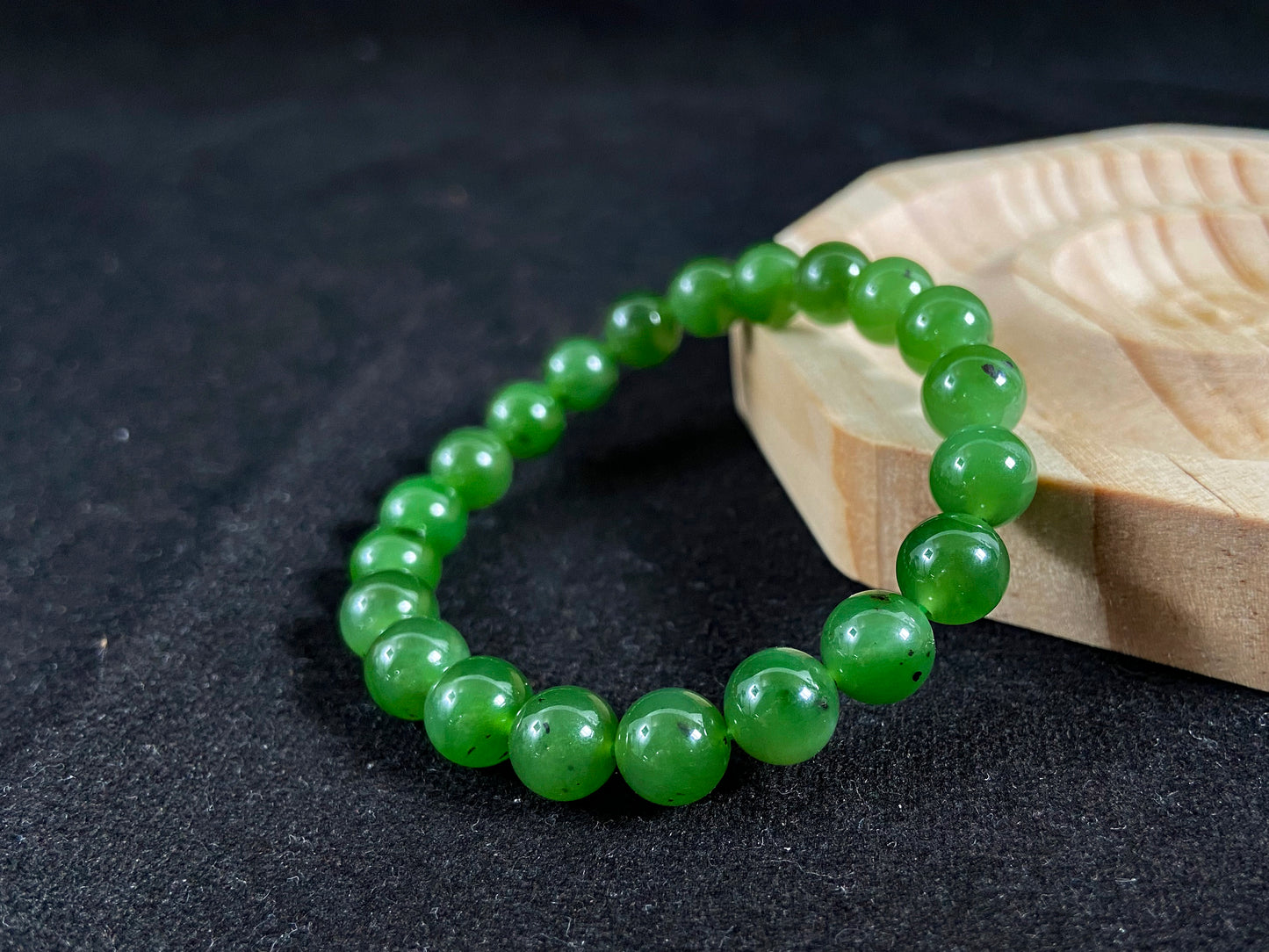 A strand of vibrant green jade beads.