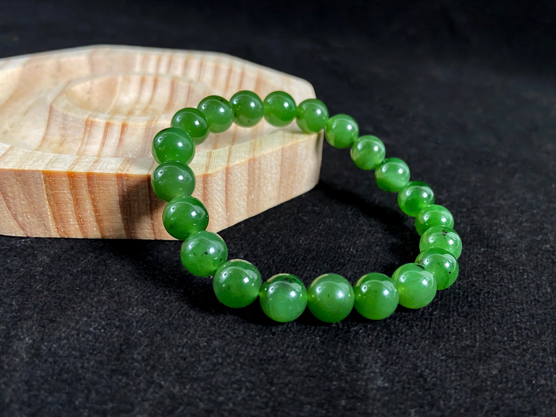 A strand of vibrant green jade beads.