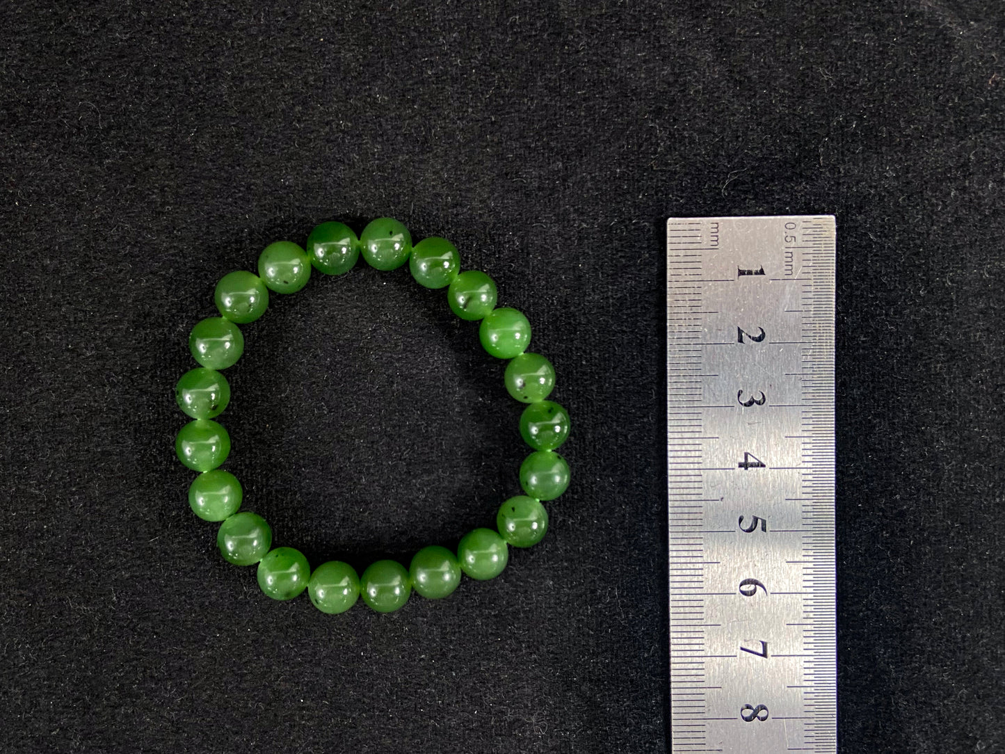 A strand of vibrant green jade beads.