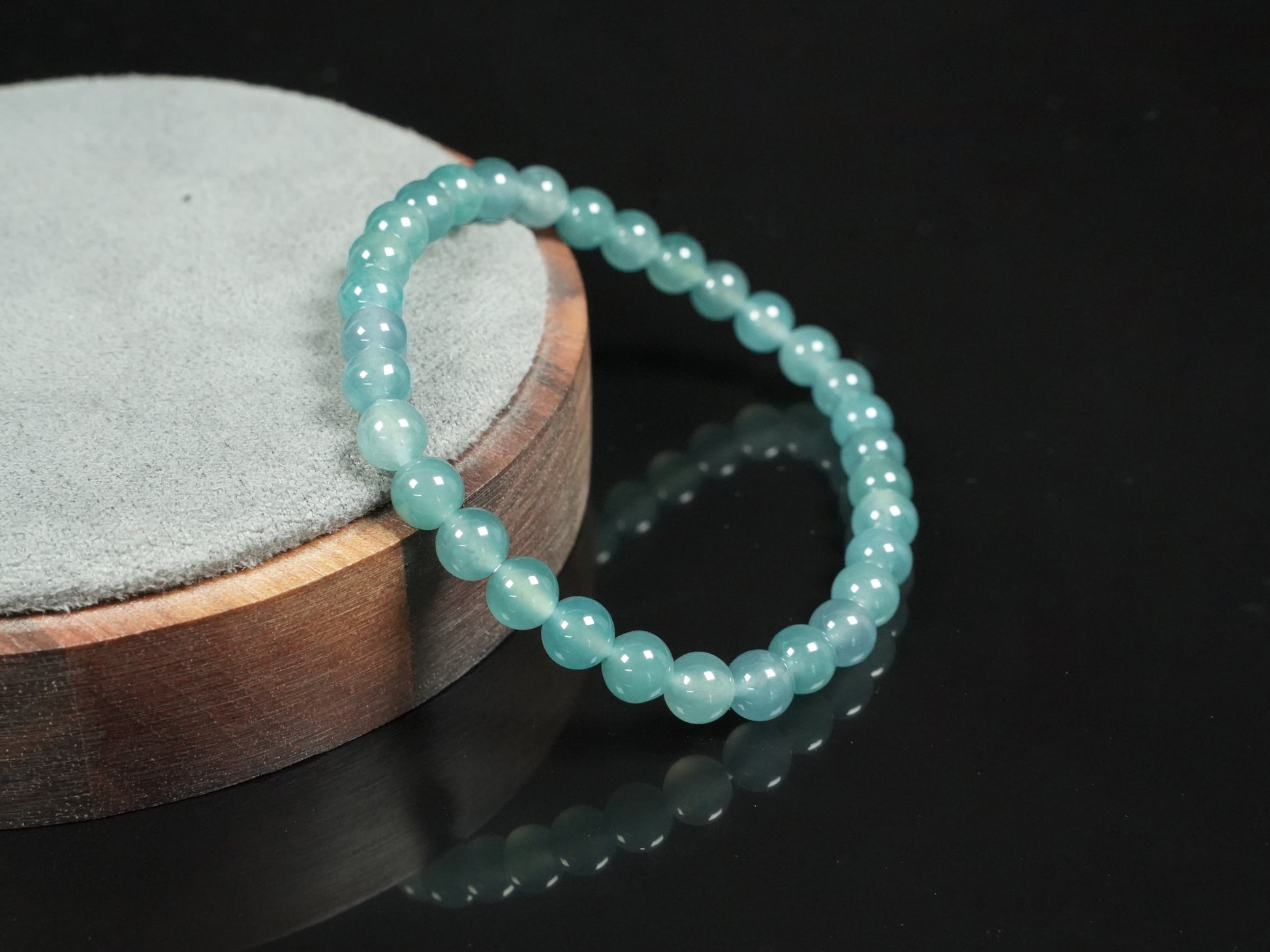 This is a pale lake-blue jadeite bracelet.
