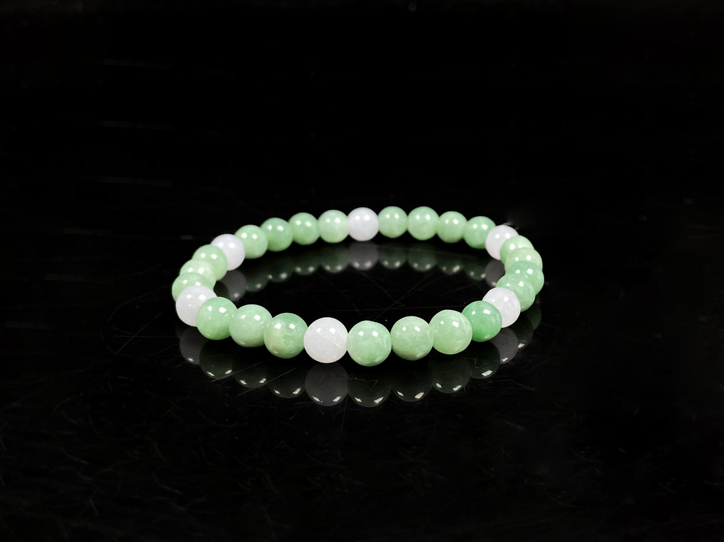A verdant white peace jadeite beads bracelet.