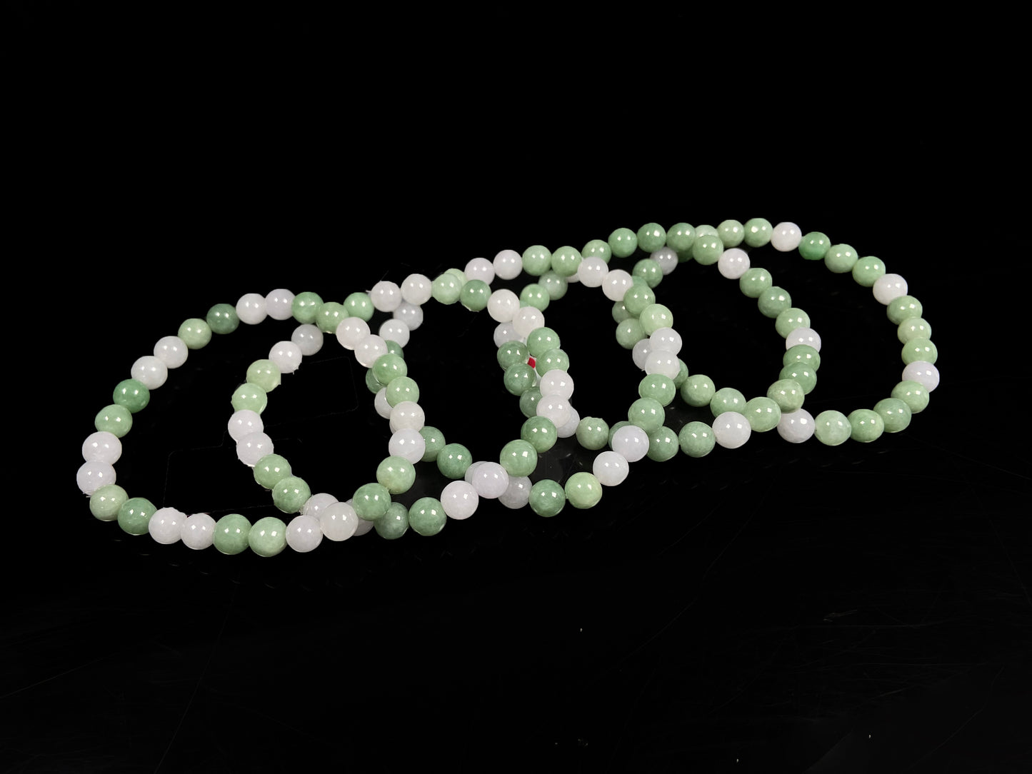 A verdant white peace jadeite beads bracelet group.