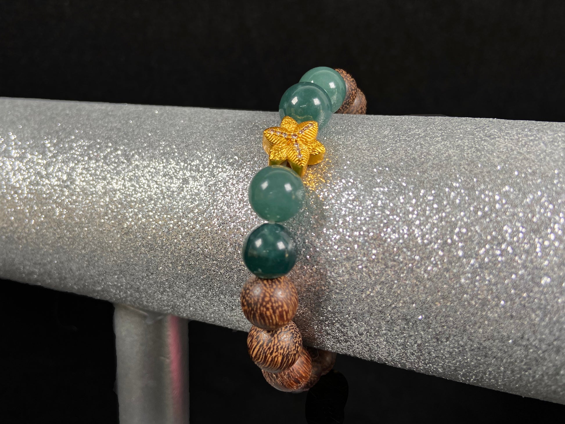A golden star’s fortune blue bead jadeite brown agarwood bracelet.