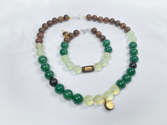 A necklace and bracelet crafted from brown agarwood, green Hetian jade and yellow citrine beads.