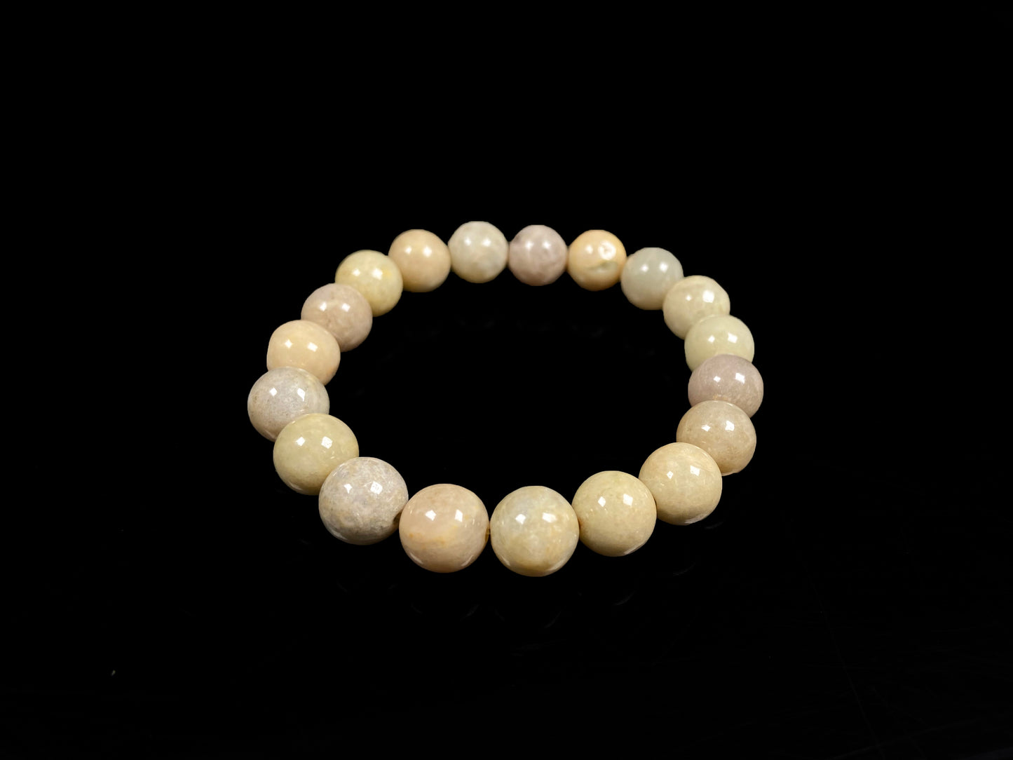 A warm beige serenity jadeite beads bracelet.