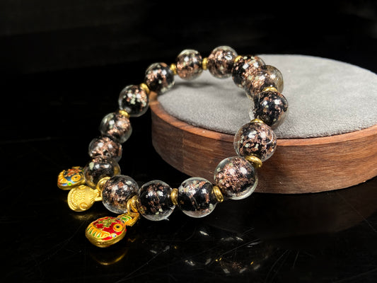 A midnight sparkle incense ash Liuli beaded bracelet.
