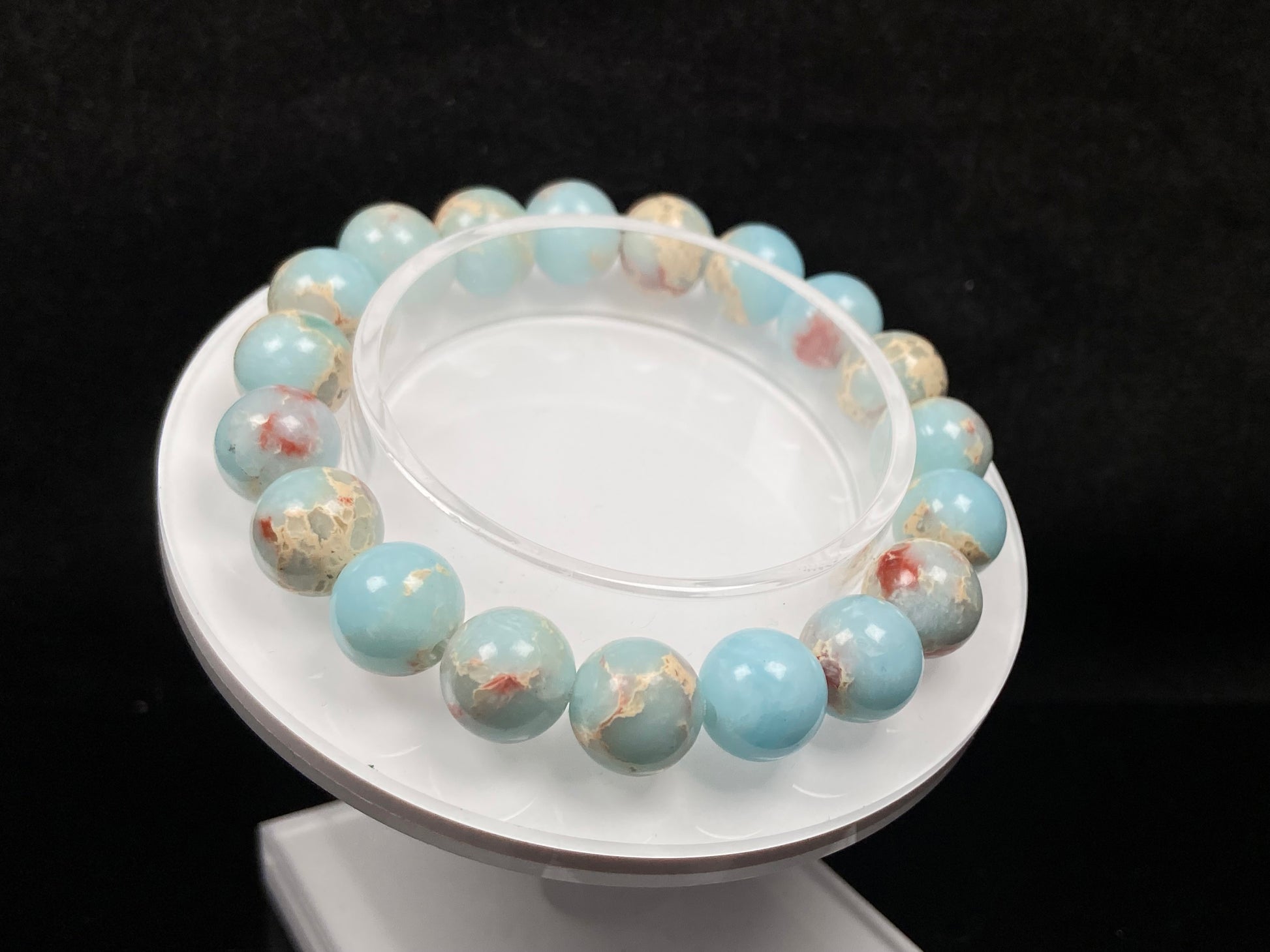 A red whispers in blue and white Shoushan stone beaded bracelet.