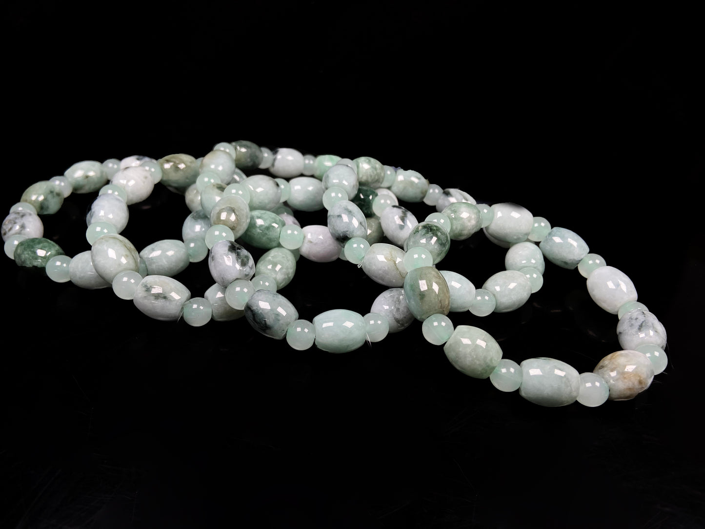 A group of tri-color green white gray barrel & round beads jadeite beads bracelet.