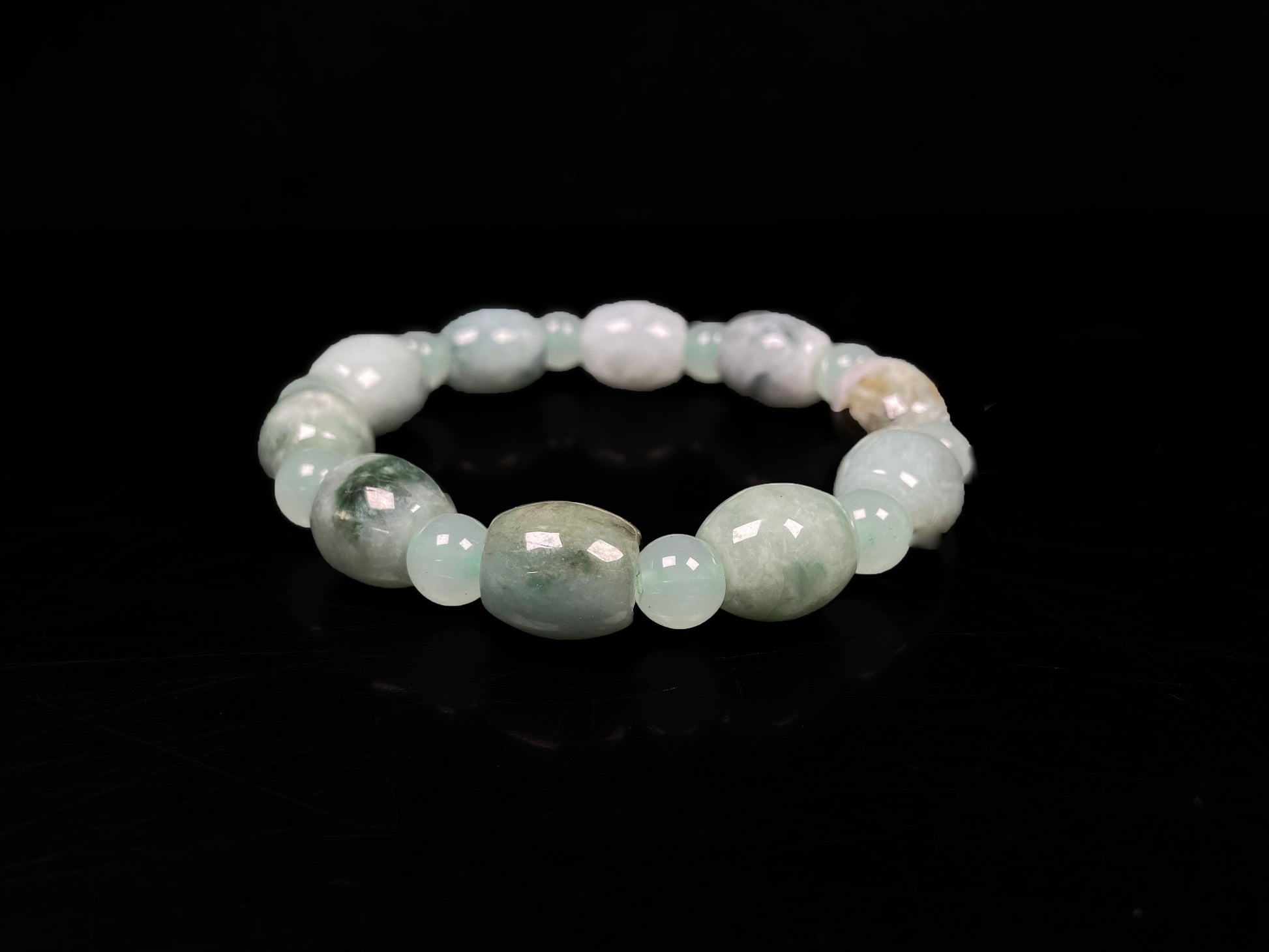 A tri-color green white gray barrel & round beads jadeite beads bracelet.