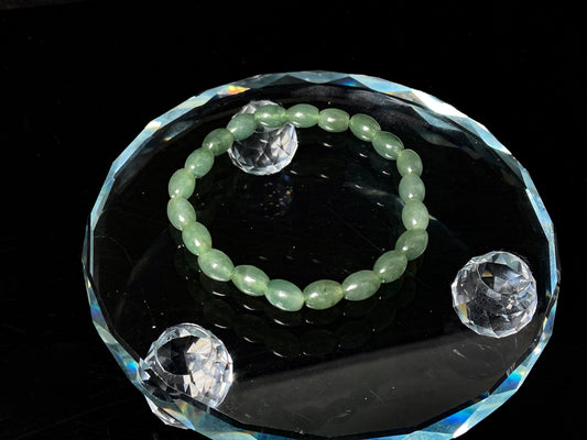 A green shadow luminance jadeite beads bracelet.