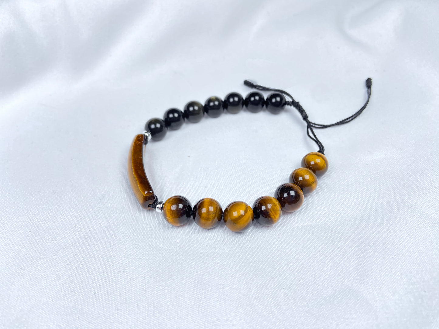 A black and gold contrast natural tiger's eye beaded bracelet.