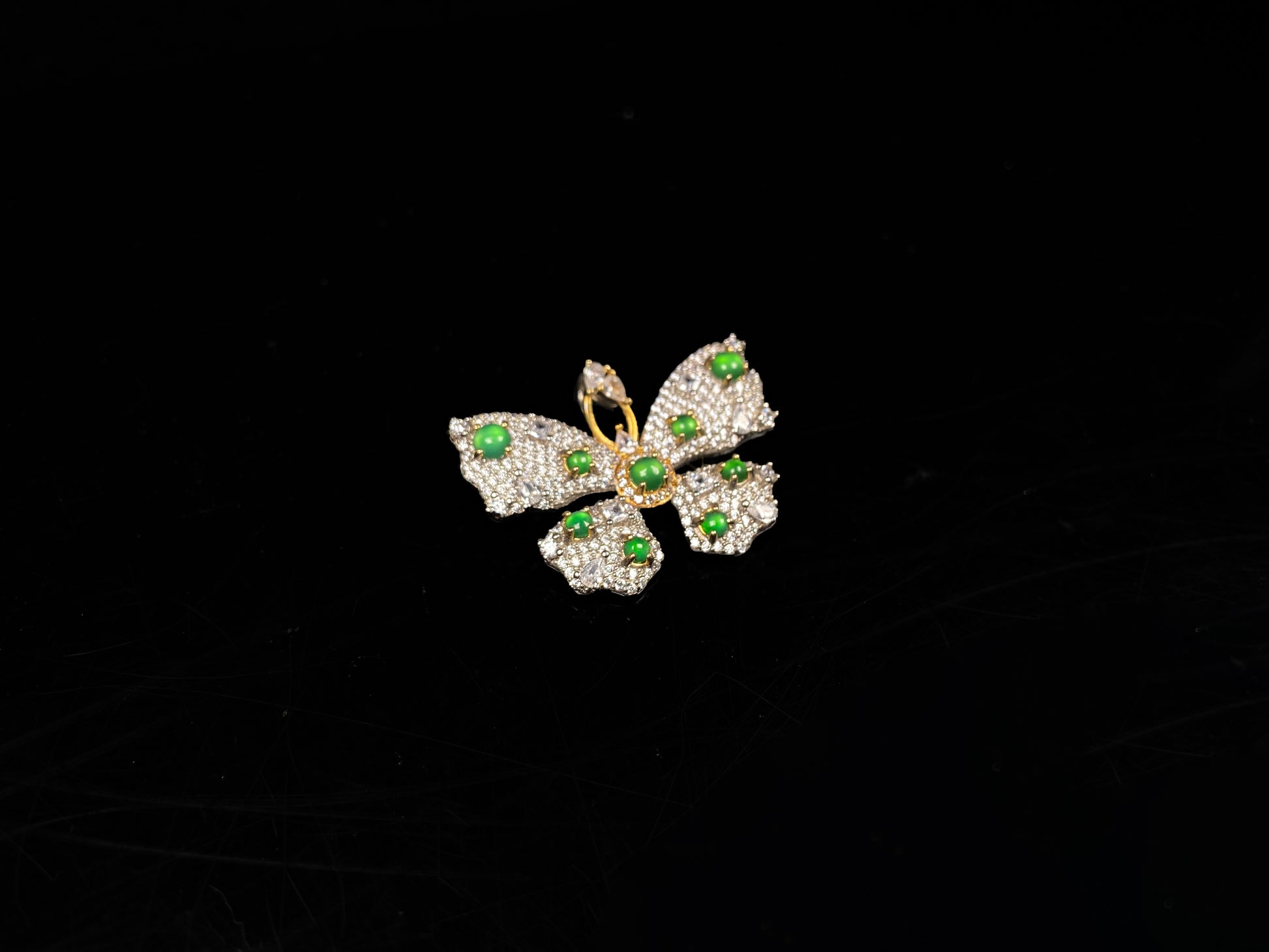 A green butterfly sparkle jadeite pendant.