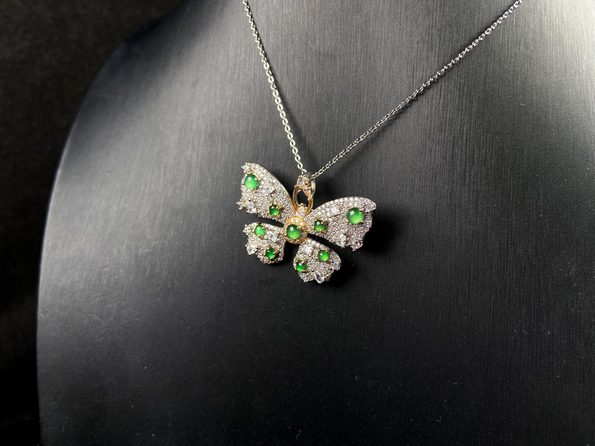 A green butterfly sparkle jadeite pendant.