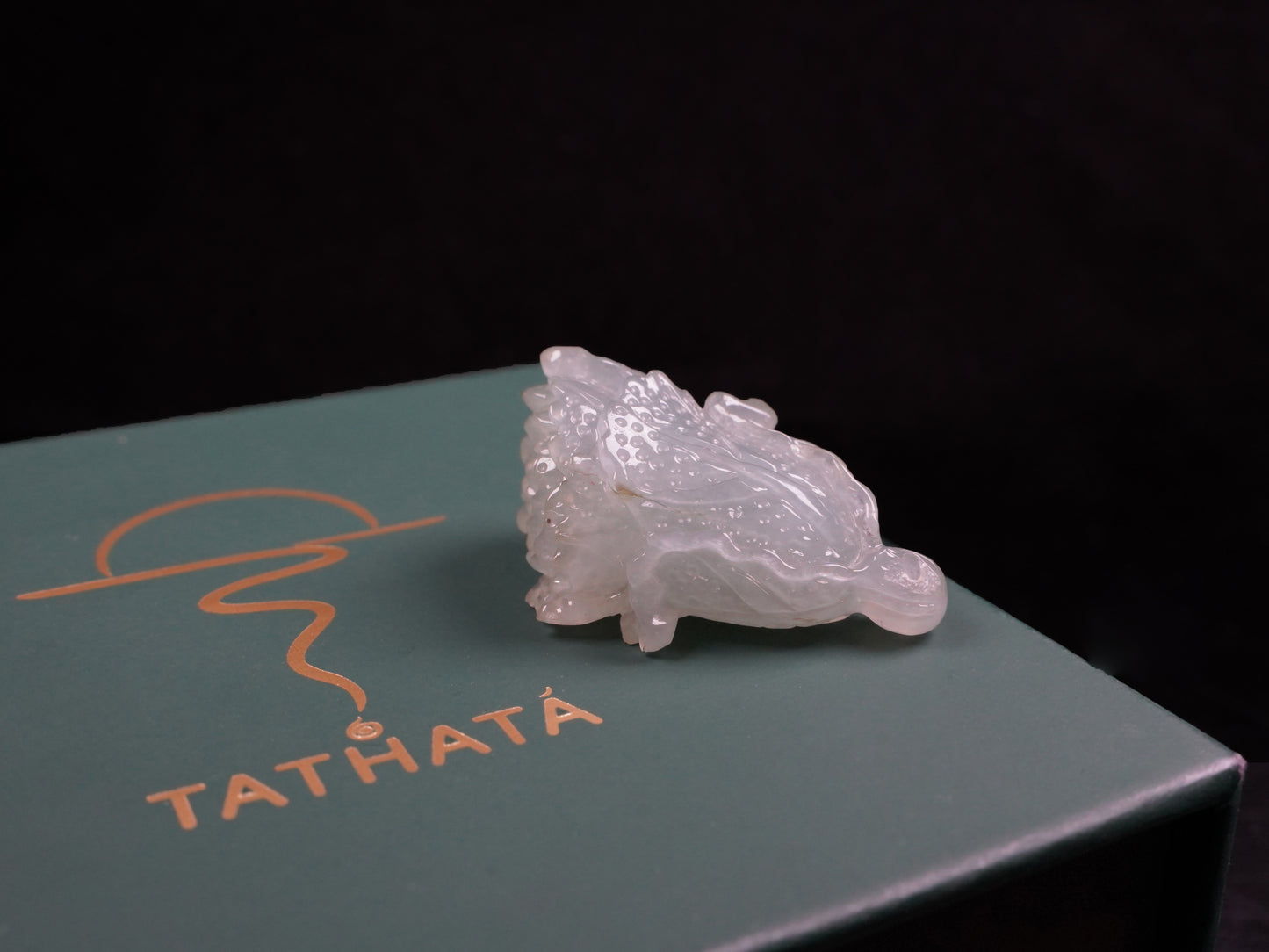 A delicate icy light green cabbage loose jadeite.