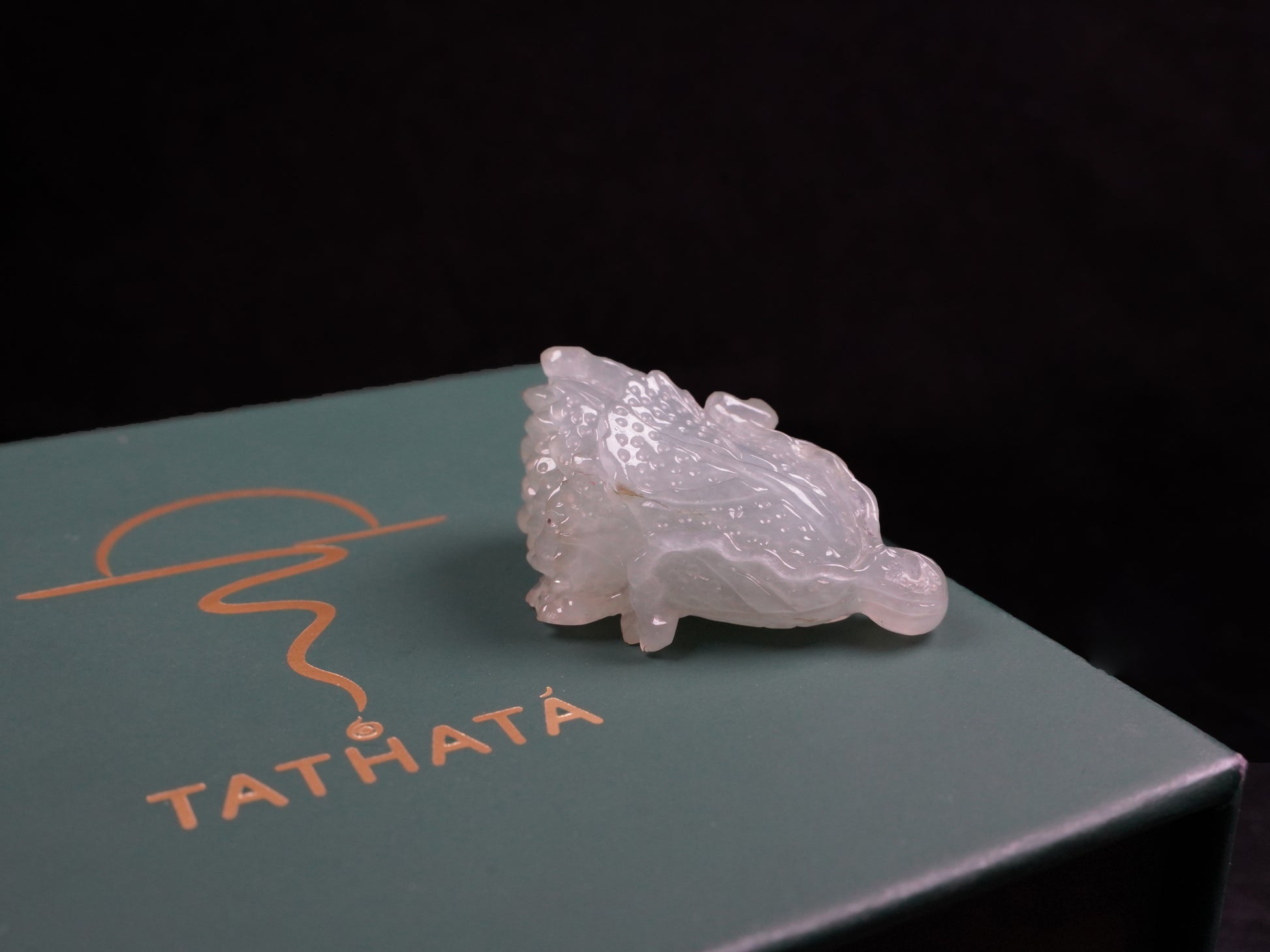 A delicate icy light green cabbage loose jadeite.