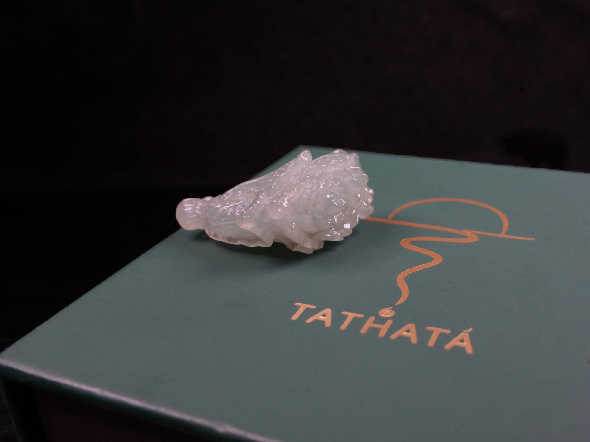 A delicate icy light green cabbage loose jadeite.