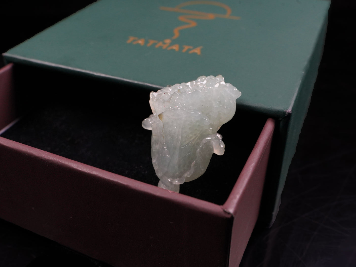 A delicate icy light green cabbage loose jadeite.