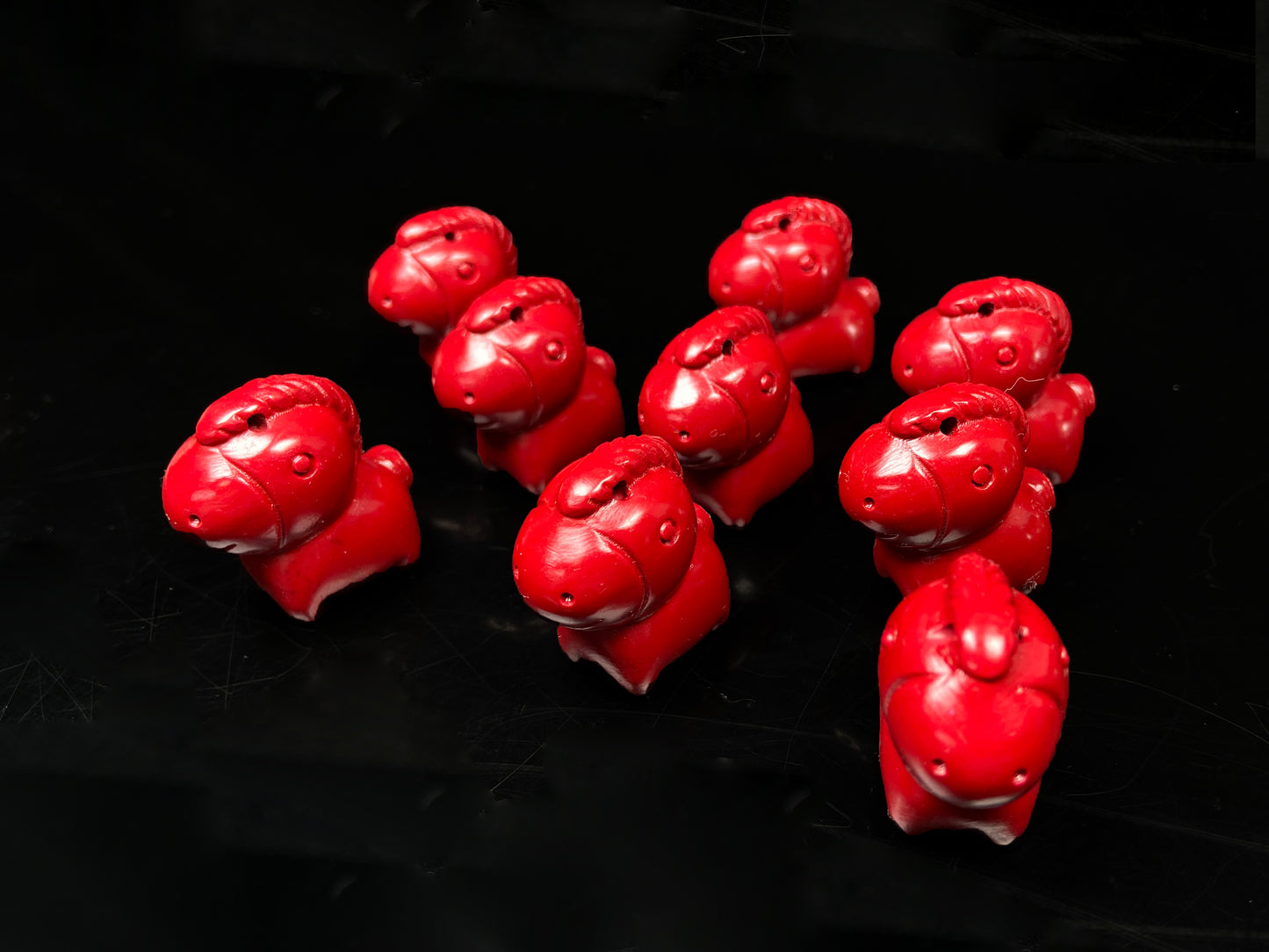 A red cute fortune cinnabar horse group.