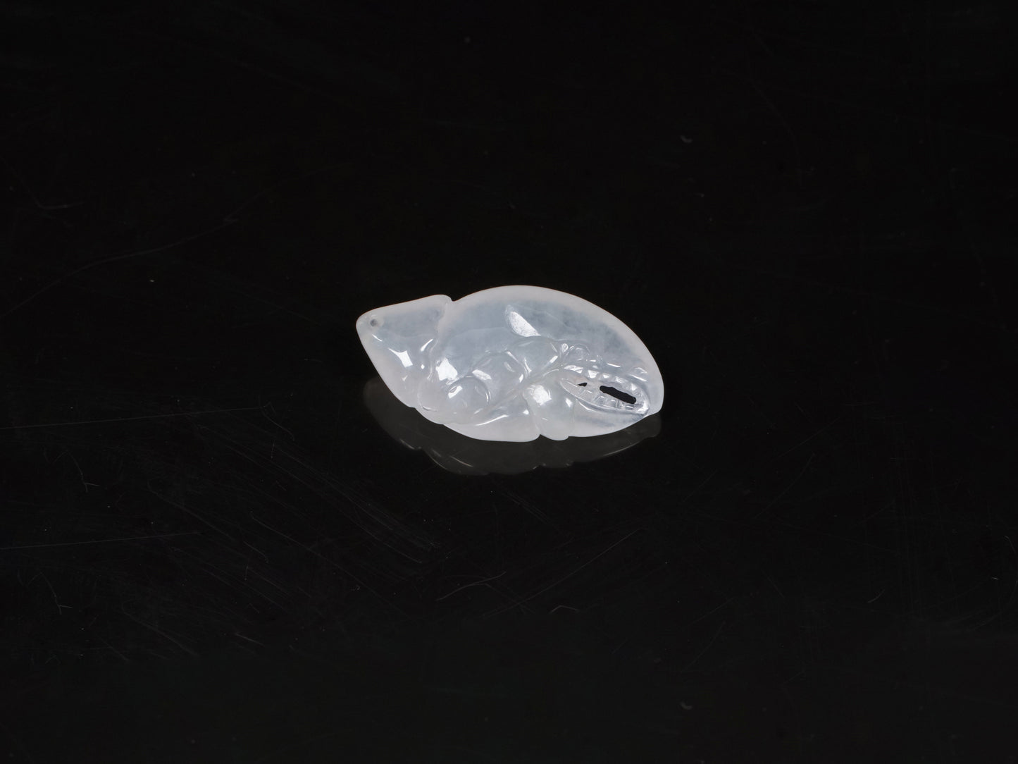 Icy translucent white crab claw loose jadieite.