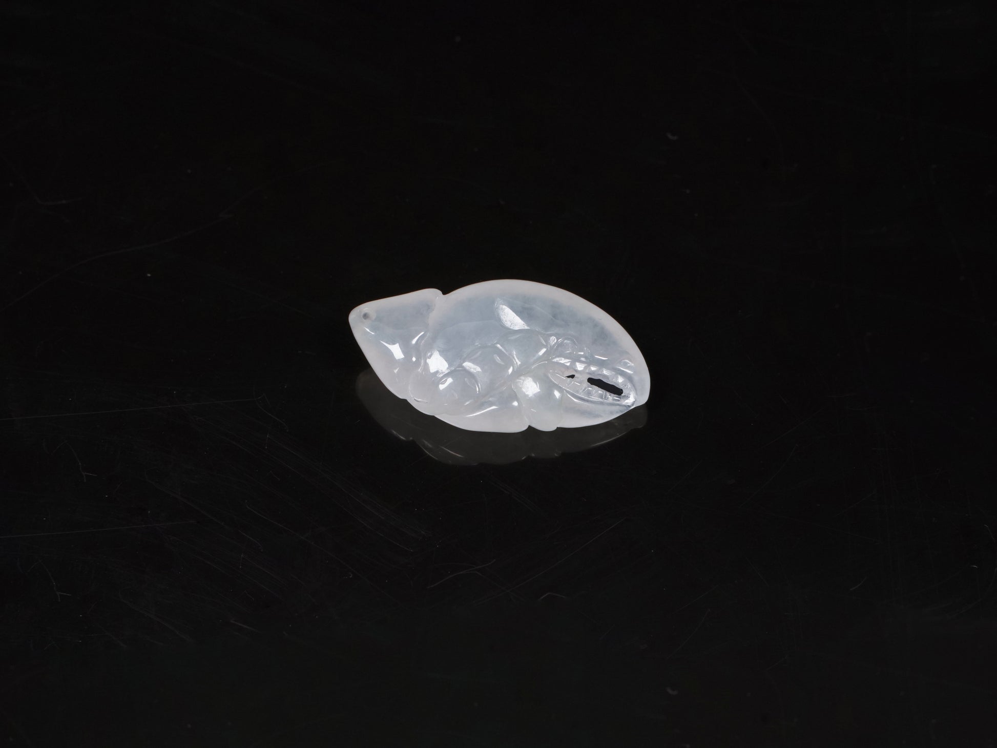 Icy translucent white crab claw loose jadieite.