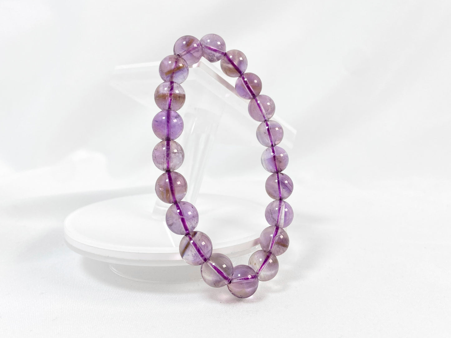 A bead strand crafted from ametrine crystals.