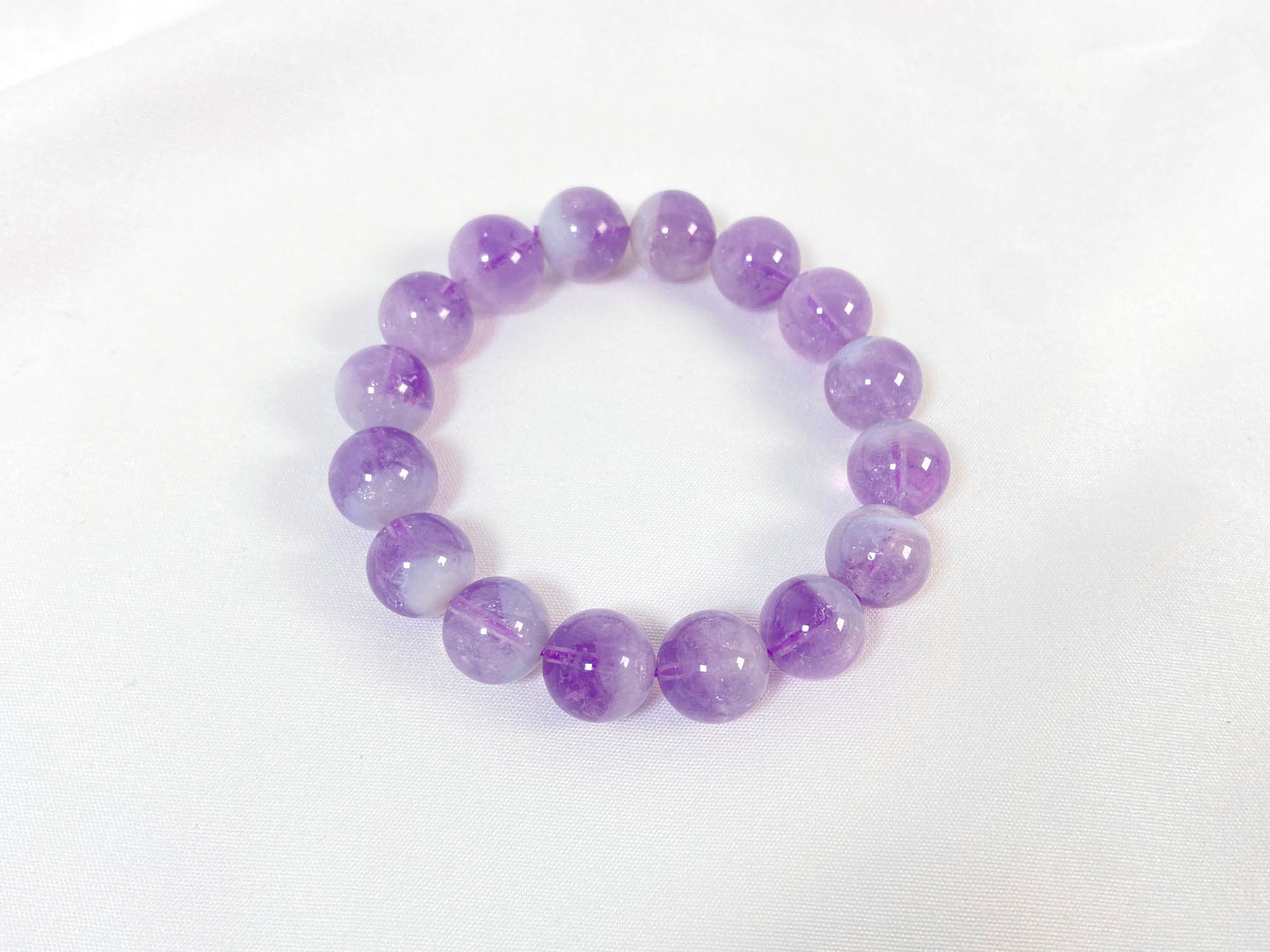 This bracelet features genuine amethyst beads.