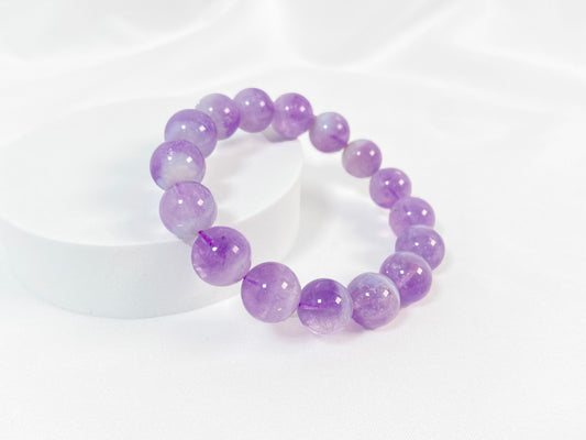 This bracelet features genuine amethyst beads.