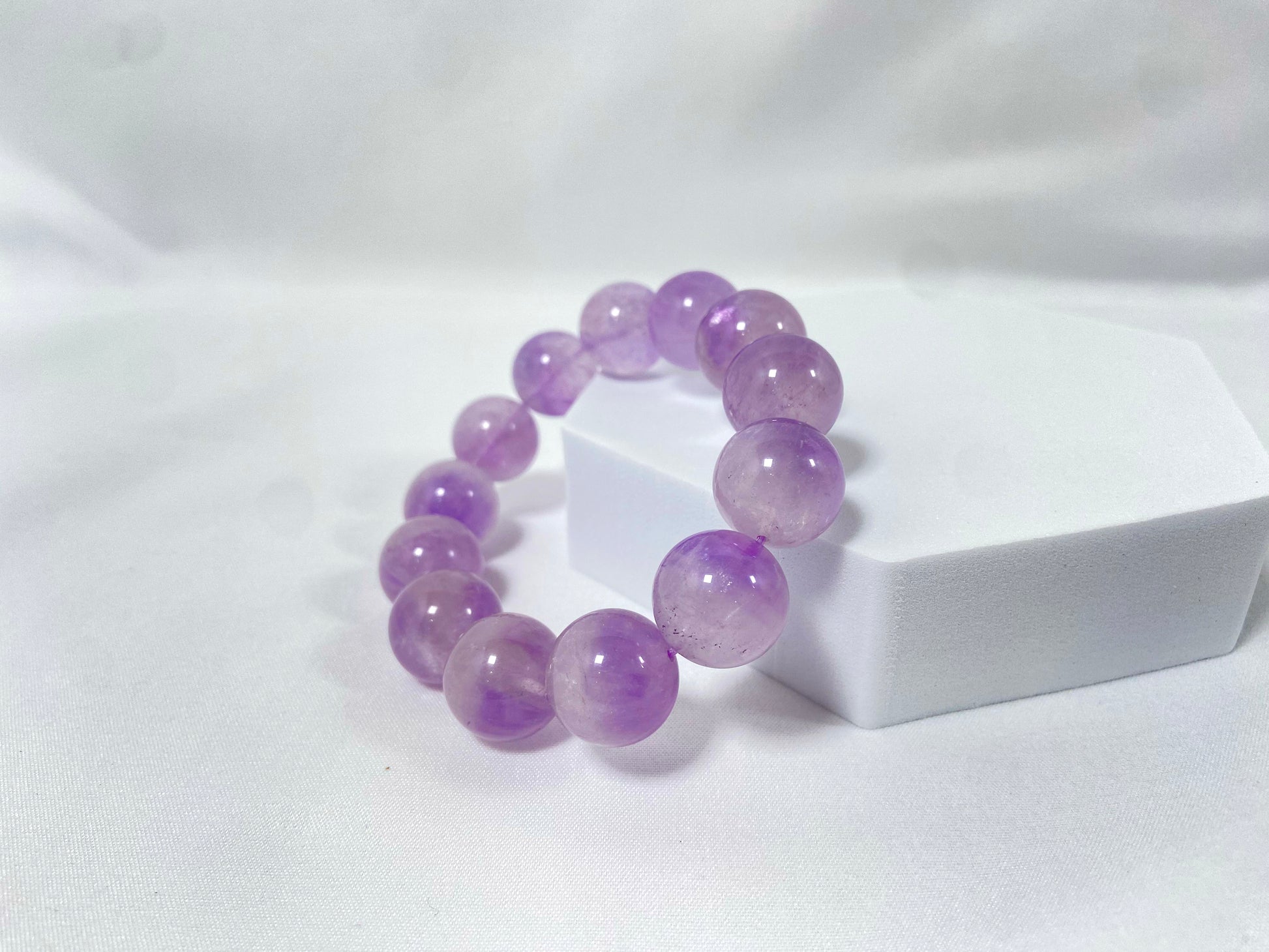 Amethyst crystal beads hand strung on an elastic cord.