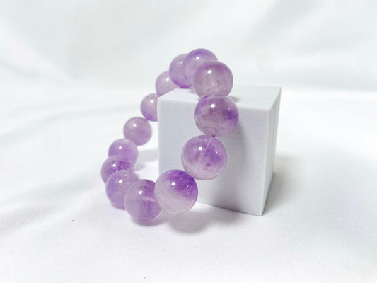 Amethyst crystal beads hand strung on an elastic cord.