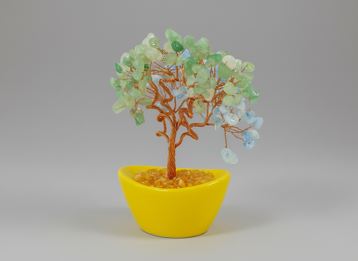 Decorative tree with blue and green leaves in a yellow pot on a white background