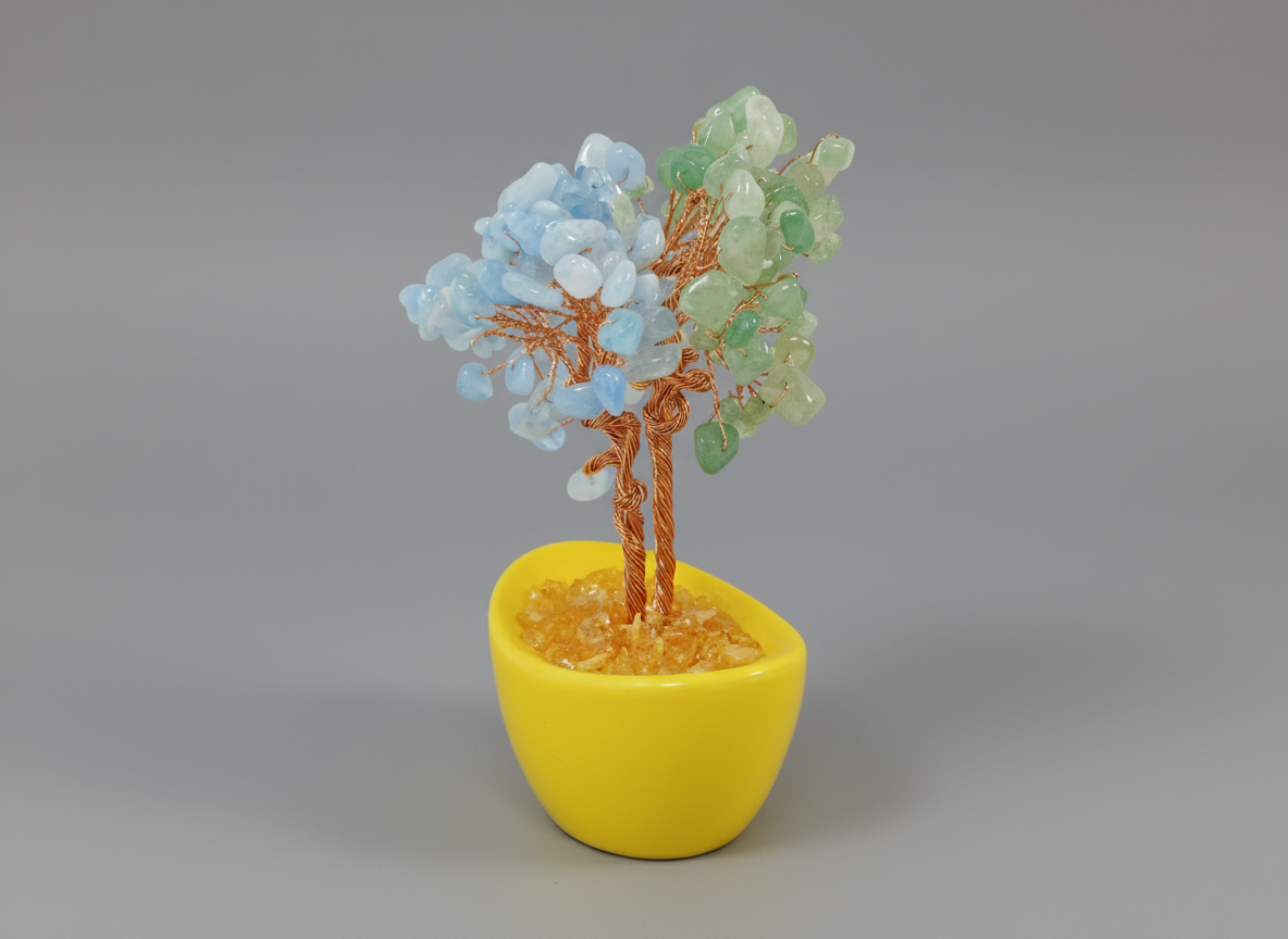 Decorative tree with blue and green leaves in a yellow pot on a white background