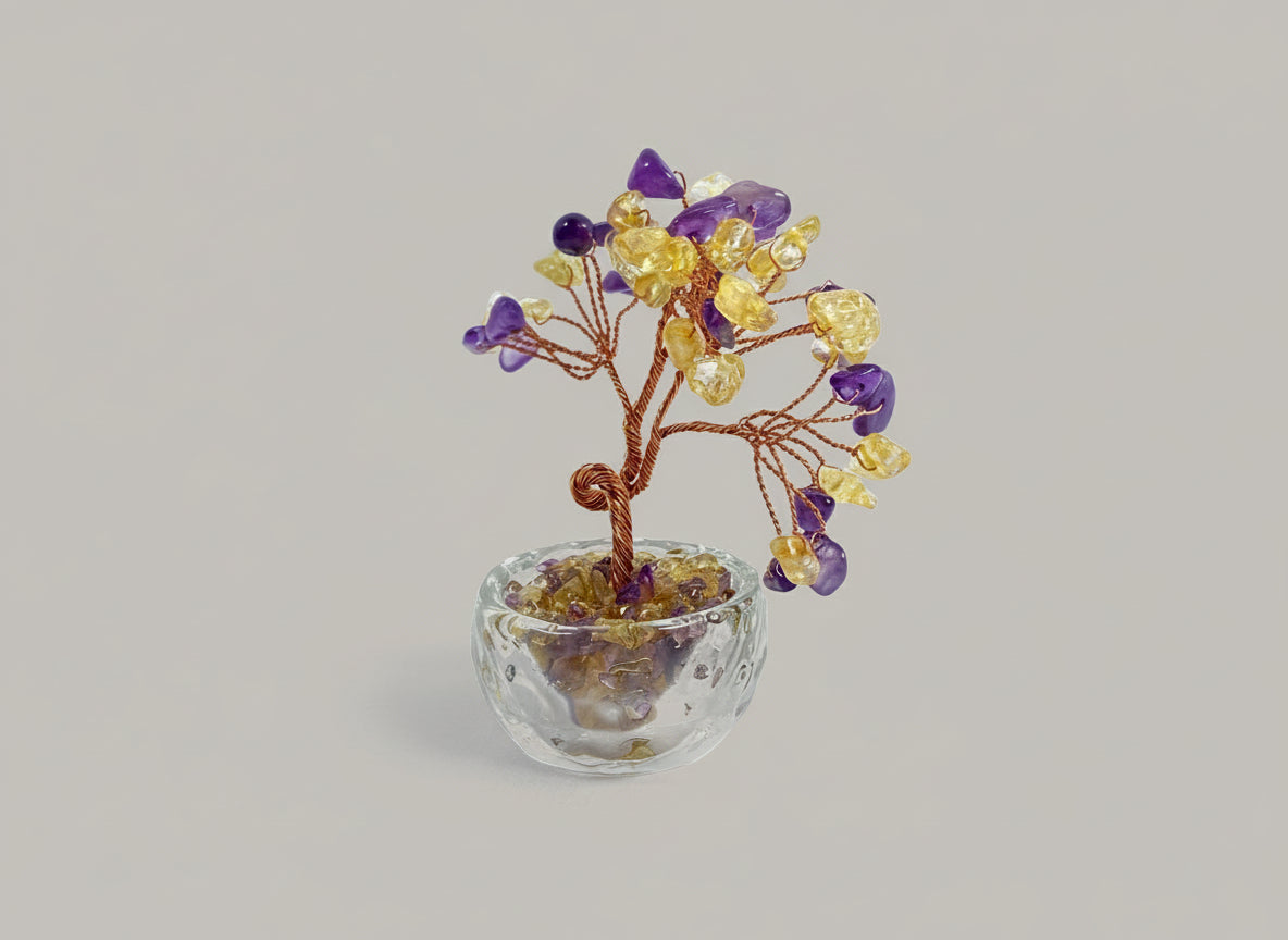 This crystal tree is crafted from Amethyst-Citrine, a unique natural bicolor crystal.
