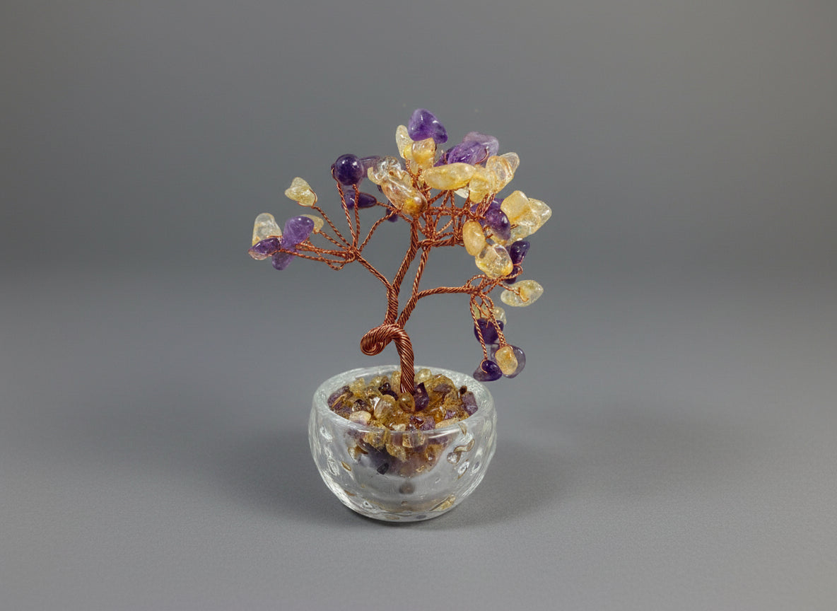 This crystal tree is crafted from Amethyst-Citrine, a unique natural bicolor crystal.