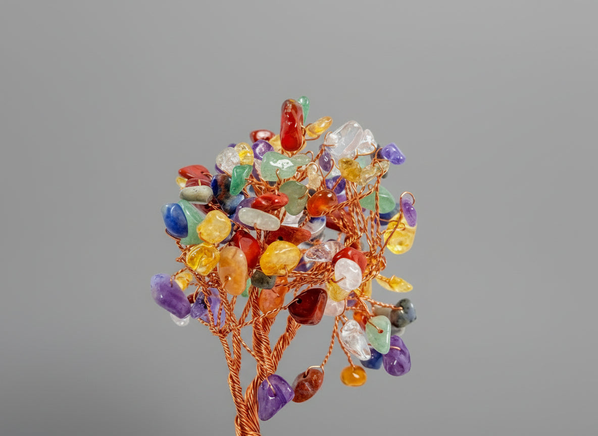 A crystal tree made with amethyst, citrine, green crystal, red crystal, and rose quartz.