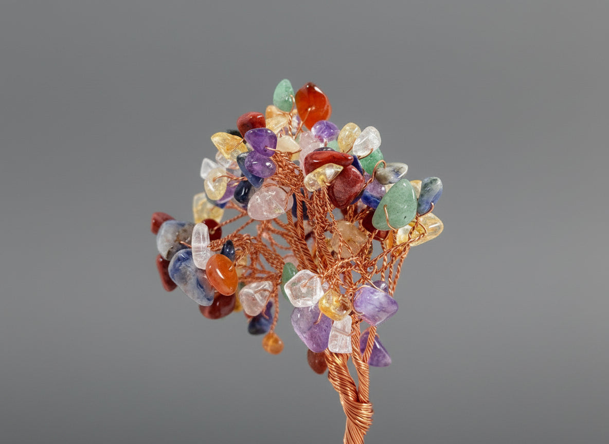 A crystal tree made with amethyst, citrine, green crystal, red crystal, and rose quartz.