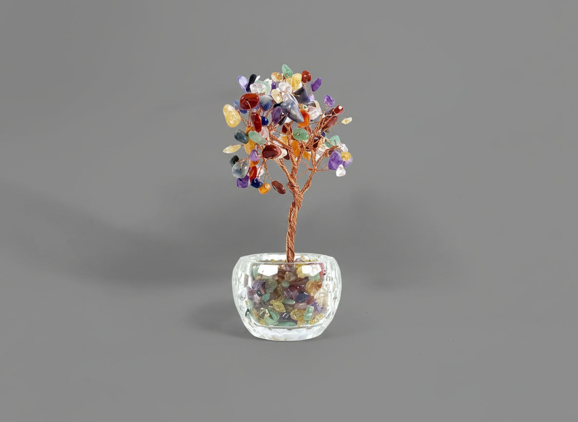 A crystal tree made with amethyst, citrine, green crystal, red crystal, and rose quartz.
