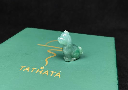 A pale green adorable puppy loose jadeite.