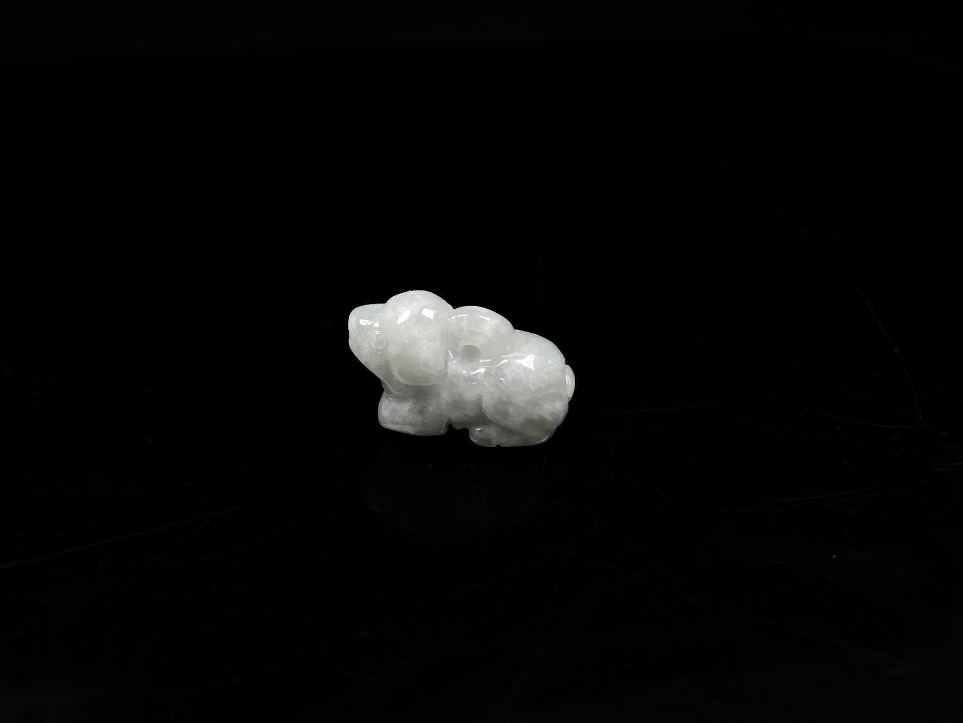 A translucent pale white dog loose jadeite.